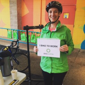 Our first bike commuter kicks off our morning with a smile. - Bike to Work Austin 2015