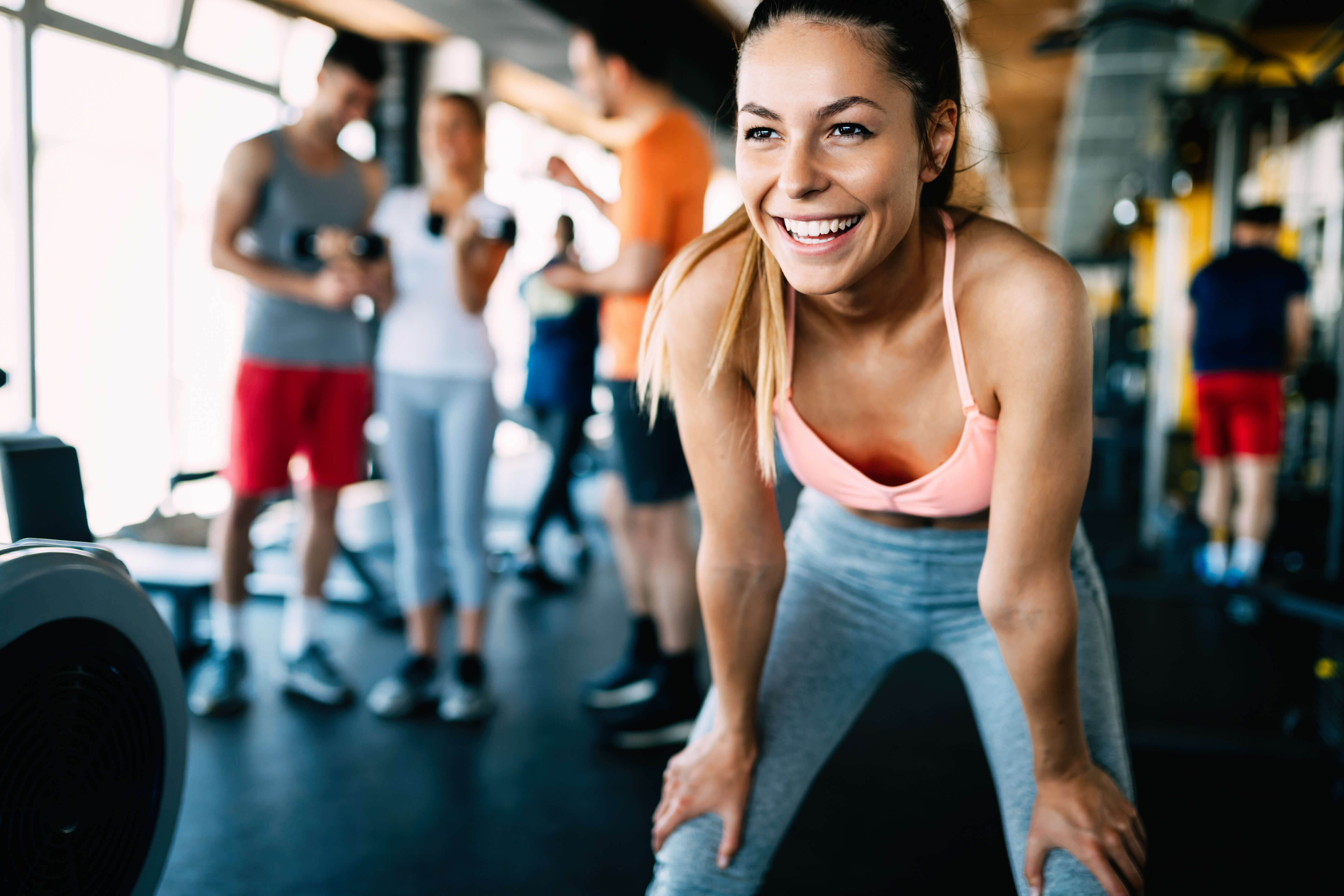 young woman smiling in a gym