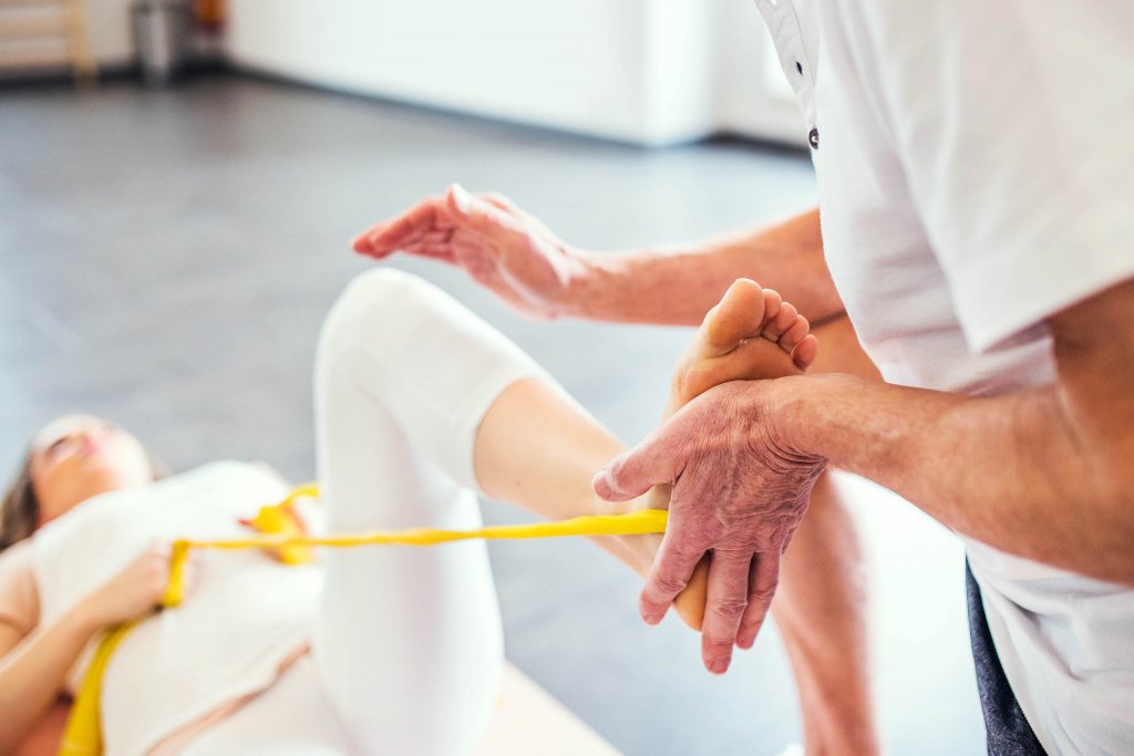 Rehabilitative exercise stretch being performed on a client