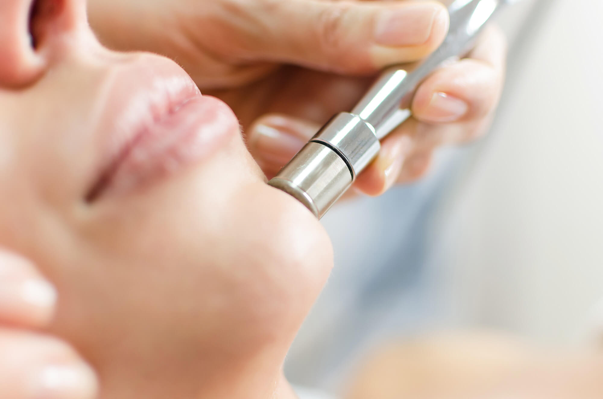 Diamond microdermabrasion, peeling cosmetic. woman during a microdermabrasion treatment in beauty salon