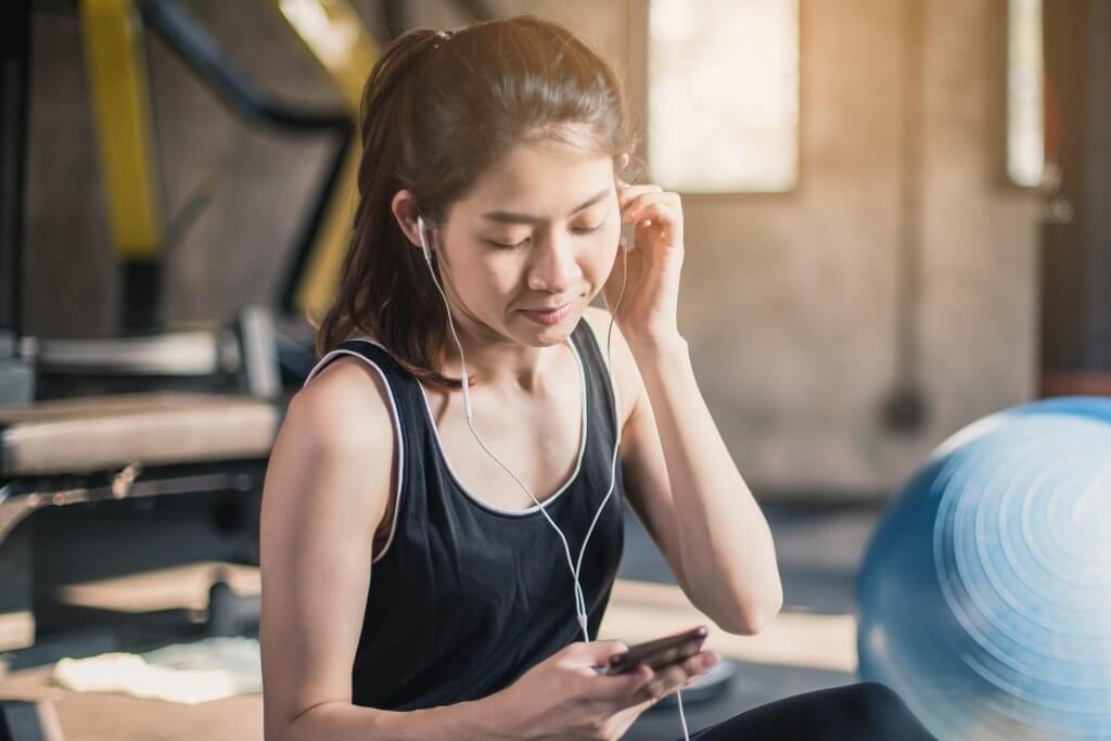 Staff Picks: Spotify Playlists Woman Listening to Headphones
