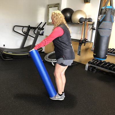 Personal Trainer Leslee Felman Demonstrating Starting Position of Single Legged Deadlifts