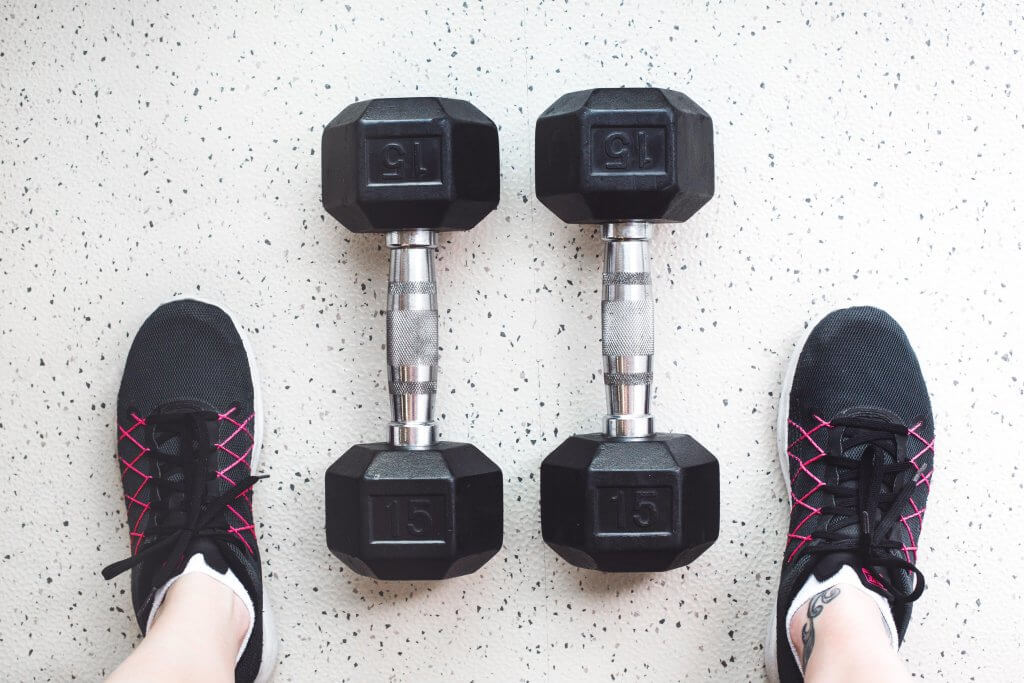 Dumbbells and gym shoes for at home gym equipment