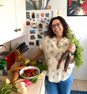Health Coach Tara Penawell with Farm to Table Produce for Shape Your Kitchen blog