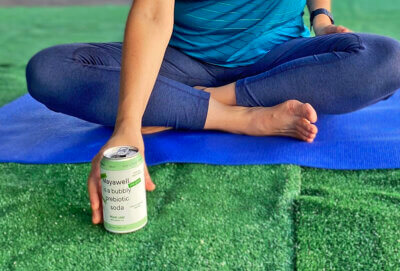 Mayawell Can in front of a yoga mat