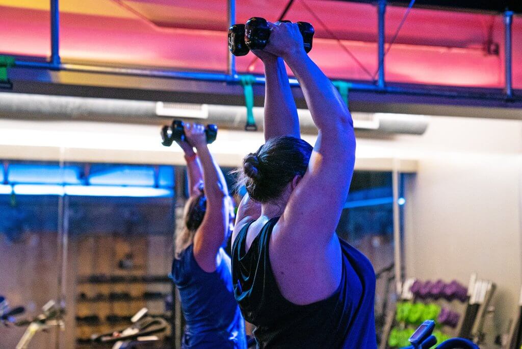 Photo of people using weights in Keith's HIIT Cycle class for Low-Impact Exercise blog