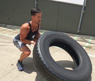 Personal Trainer Jeremy Sims flipped a large tire outside