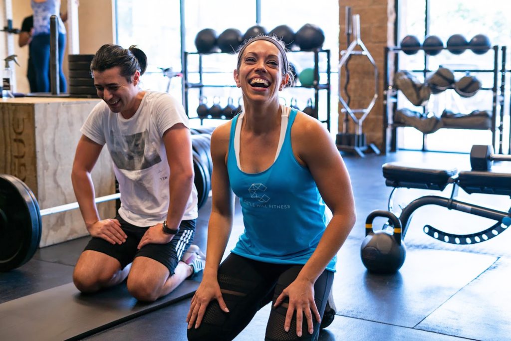 Image of Personal Trainer Sonya sitting and laughing with a client