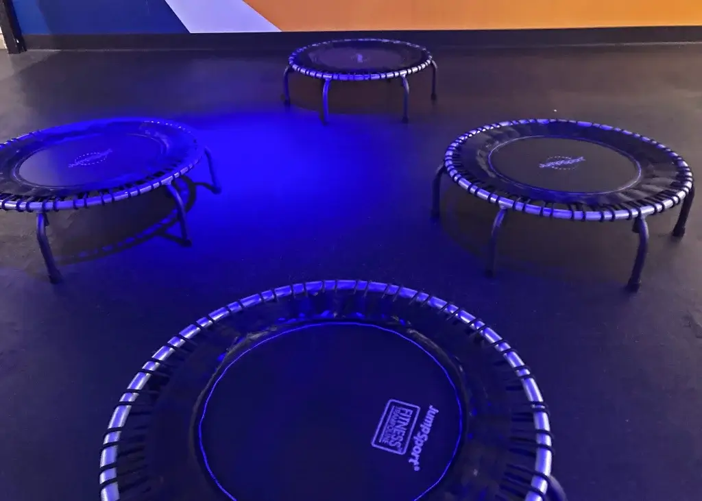 The Benefits of Rebounding Four mini-trampolines set up for a rebounding class
