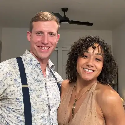 Texas-Two Step dance instructors Meadow and John posing together and smiling. 